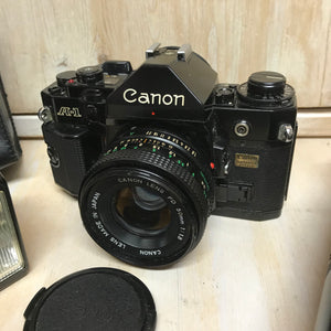 CANON A-1 analog camera with 2 lenses FD 50 100-200mm flash